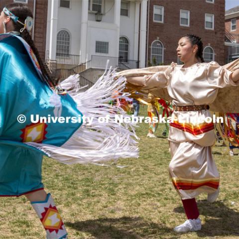 Stevie Horse (left) and Tally Redboy dance during the UNITE powwow. 2022 UNITE powwow to honor graduates (K through college). Held April 23 on the greenspace along 17th Street, immediately west of the Willa Cather Dining Center. This was UNITE’s first powwow in three years. The MC was Craig Cleveland Jr. Arena director was Mike Wolfe Sr. Host Northern Drum was Standing Horse. Host Southern Drum was Omaha White Tail. Head Woman Dancer was Kaira Wolfe. Head Man Dancer was Scott Aldrich. Special contest was a Potato Dance. April 23, 2023. Photo by Troy Fedderson / University Communication.